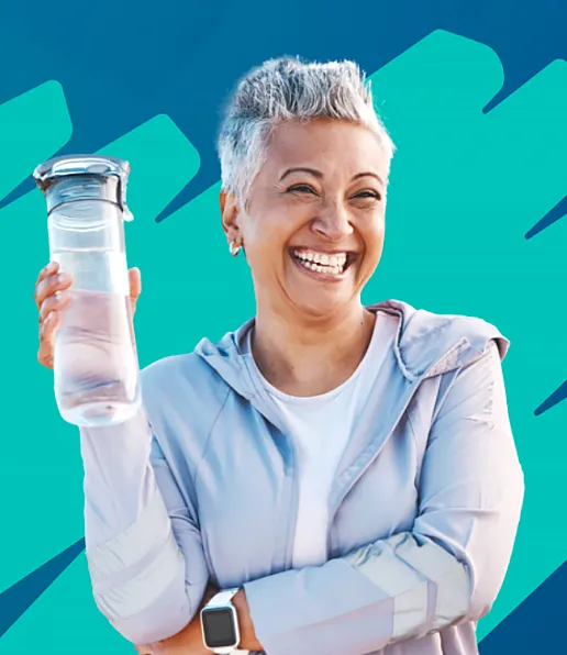 Smiling older woman with short grey hair holds up a clear water bottle. She wears a light athletic jacket and a smartwatch, standing against a blue and teal abstract background—perfect for promoting heart health with Western Cardiology.